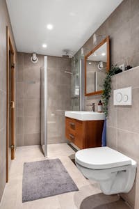 Stylish bathroom in hotel with modern fixtures and elegant interior design.